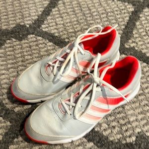 Barley worn adidas women’s golf shoes.